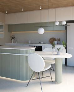 a kitchen with an island table and white chairs