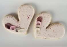 two cookies shaped like hearts with crayons in them