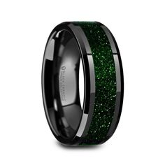 black ceramic ring with green glitter inlays and beveled inside the band