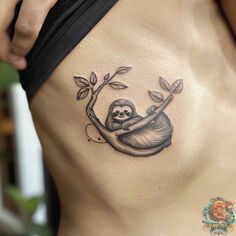 a slotty tattoo on the side of a woman's stomach