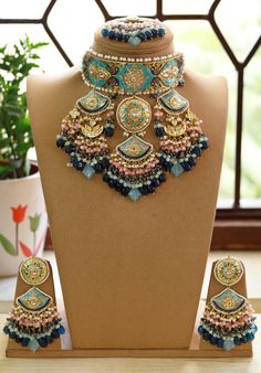 Gorgeous Sabyasachi inspired Meenakari Stones Choker Necklace with matching earrings and Maang tika. Fine quality and craftsmanship. Perfect Jewelry for weddings. Necklace comes in drawstring cord therefore adjustable Please let me know if you have any questions Luxury Cutdana Jewelry For Navratri, Long Indian Necklace, Green Beads Necklace, Pair Necklace, Maang Tika, Green Beaded Necklace, Necklace Indian, Stone Choker, Indian Necklace