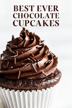 a cupcake with chocolate frosting and sprinkles on top is shown