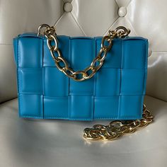 -Luxury Style Handbag With Goldtone Top Chainstrap And Crossbody Chainstrap -Teal Color Perfect For Spring/Summer -Measures Approximately 8.5”X5”X2”; 4.5” Drop Top Handle Chainstrap And 20” Drop Crossbody Chainstrap -Detachable Interior Zippered Pouch