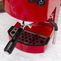 an espresso machine sitting on top of a counter