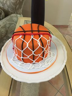 a cake that is decorated with a basketball net