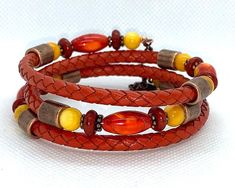 This one of a kind bracelet is made from copper memory wire and 5mm braided leather in orange and adorned with orange Agate beads, rust Howlite, yellow River Shell and antique copper metal spacers beads.  Bracelet is made of memory wire and will fit most wrist sizes.   I invite you to come on in and browse my shop's entire selection of handcrafted jewelry! https://www.etsy.com/shop/BeauFaireCreations Adjustable Copper Bohemian Braided Bracelet, Adjustable Copper Braided Bohemian Bracelet, Adjustable Bohemian Copper Braided Bracelet, Adjustable Brown Copper Braided Bracelets, Paper Bead Bracelet, Yellow River, Orange Agate, Memory Wire Bracelet, Memory Wire Bracelets