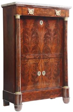 an ornate wooden cabinet with two drawers