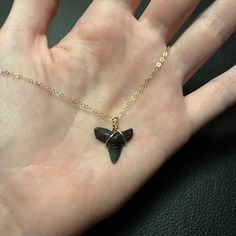 A fossilized shark tooth pendant on an 18-inch 14k gold-filled chain. NOTE: The size and shape of the tooth may vary, but they will be close to the shown image! These shark teeth are ethically sourced and over 10,000 years old (but could be up to 400 million so finding exact matches can be a bit difficult! Shark Teeth Bracelet, Gold Arrowhead Necklace Gift, Gold Arrowhead Necklace As A Gift, Gold Arrowhead Necklace For Gift, Gold Arrowhead Jewelry Gift, Gold Arrowhead Jewelry For Gift, Nickel-free Arrowhead Necklace Gift, Nickel-free Arrowhead Necklace For Gift, Nickel Free Arrowhead Necklace For Gift