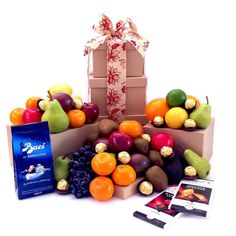 an assortment of fruit and chocolates in boxes