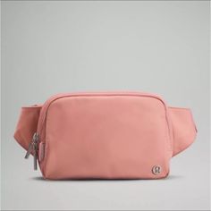 Lululemon Everywhere Belt Bag 1l - Pastel Pink Nwt Authentic Lululemon Pink Pastel Belt Bag. New In Wrapper New With Tags! Sold Out Immediately Online And In Stores. Get This Here :) Absolutely Beautiful Color. My Favorite!! Exterior Zippered Pocket To Secure Your Valuables Two-Way Zipper Interior Pockets Hold The Essentials Once You Find Your Perfect Fit, Tuck The Excess Belt Bag Strap Into The Elastic Loops Super Cute And Rare!! Please Check Out My Other Listings I’m A Trusted Seller!!! :) Fre Lululemon Fanny Pack, Crossbody Fanny Pack, Mesh Backpack, Lululemon Bags, Lululemon Everywhere Belt Bag, Everywhere Belt Bag, Day Backpacks, Lululemon Outfits, Canvas Leather Bag