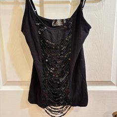 Nwot Vintage Guess Black Sequin Tank Top Size: Small Brand: Guess Description Sequin Ripped Distressed Black Y2k Party Tank Top Colors: Black, Silver Ripped Sequin Beaded Tank Top Design String Like Sequin Bodice Vintage Guess From The 2000’s Spaghetti Straps Mesh Underlay Behind Sequins Double Lined Not See Through Selling Other Beaded Items On My Page New Without Tags Makeup Body: 95% Rayon; 5% Spandex Mesh: 100% Nylon Washing Instructions Hand Wash Cold Do Not Wring Do Not Bleach Line Dry Cool Iron If Needed Do Not Iron Decoration #Sequin #Y2k #Guess #Partytop #Beadedtop Beaded Tank Top, 2010 Party Outfit, Y2k Tank Camisole For Parties, Black Y2k Style Sleeveless Camisole, Black Fitted Y2k Camisole, Black Y2k Sleeveless Camisole, Black Sequin Tank Top, 2000s Tops, Carrie Diaries