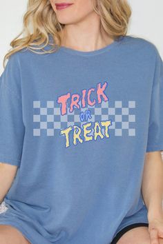 Embrace the Halloween vibe with our retro-inspired graphic tee. This adorable and vibrant T-shirt effortlessly combines nostalgia and playfulness. Ideal for the season, it's the ultimate choice for a stylish trick-or-treat experience. Grab yours today! Trendy Halloween Graphic T-shirt, Halloween Graphic Tee T-shirt, Trendy Halloween Crew Neck T-shirt, Halloween Graphic Print Relaxed Fit T-shirt, Spooky Halloween T-shirt With Graphic Print, Halloween Cotton T-shirt With Text Print, Retro Halloween Short Sleeve Tops, Retro Halloween T-shirt For Streetwear, Halloween Blue Tops With Letter Print