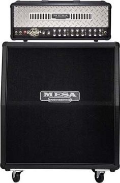 a guitar amplifier sitting on top of a black case with the words mesa written on it