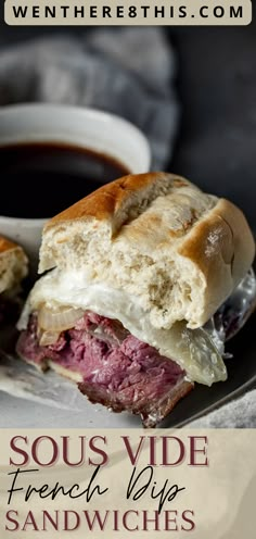 a close up of a sandwich on a plate next to a cup of coffee with the words sous vide french dip sandwiches