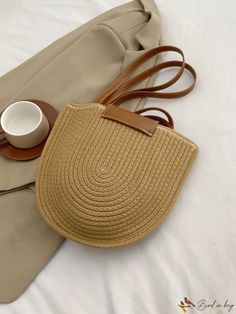 Trendy Beige Beach Bag With Adjustable Strap, Casual Brown Bucket Bag For Beach Season, Casual Straw Bag With Removable Pouch In Natural Color, Casual Beige Handheld Bucket Bag, Casual Hobo Bag With Removable Pouch For Vacation, Casual Beige Satchel With Adjustable Strap, Casual Natural Straw Bag With Removable Pouch, Casual Bucket Satchel, Casual Straw Tote Bag With Removable Pouch