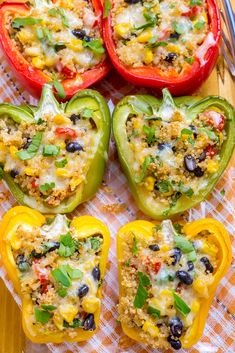 stuffed bell peppers with rice and black olives are ready to be cooked in the oven