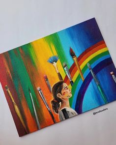 a painting of a woman with paintbrushes in her hand and rainbow behind her