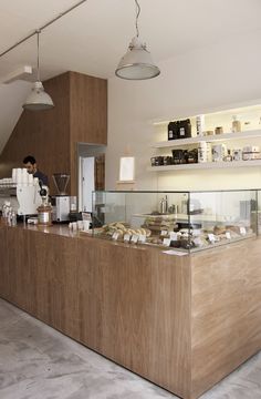 the counter is made of wood and has many items on it