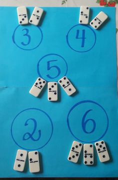 a blue paper bag with numbers and dices on it