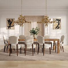 a dining room table with white chairs and chandelier