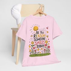 Brighten up someone's day with our "Be the Reason Someone Smiles" feel-good t-shirt. Made from ultra-soft, breathable cotton, this tee is a perfect blend of comfort and inspiration. Featuring a stylish and uplifting message, it reminds you to spread positivity and joy wherever you go. Whether you're lounging at home, heading to a casual outing, or practicing mindfulness, this t-shirt serves as a gentle nudge to make the world a little brighter, one smile at a time. Available in a variety of vibr Inspirational Pink Cotton T-shirt, Pink Cotton Inspirational T-shirt, Inspirational Slogan T-shirt For Spring, Inspirational Pink T-shirt With Text Print, Pink T-shirt With Funny Print For Everyday, Everyday Pink T-shirt With Funny Print, Practicing Mindfulness, Message Positif, Be The Reason