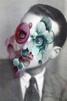 a man with flowers on his face is wearing a suit and tie, as if it were made out of paper