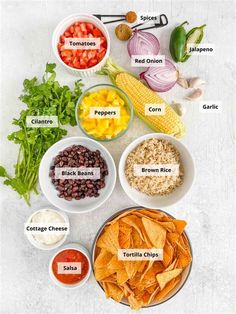 the ingredients to make an easy mexican salad laid out in bowls on a white surface