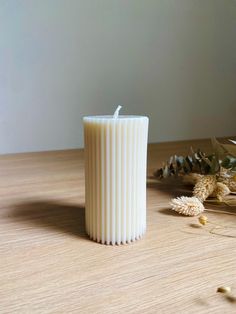 Add a touch of elegance to your home with our thick, scented pillar candles. Their ribbed design and subtle fragrance create a soothing atmosphere in any room. GENERAL INFORMATION Our candles are hand poured to order using eco-friendly and vegan ingredients. None of the products used to make our candles have been tested on animals. INGREDIENTS: 100% GMO-FREE RAPESEED WAX, CMR- AND PHTHALATE-FREE GRASSE PERFUMED OIL, COLORANT, COTTON WICK. FRAGRANCES: We use high quality, cruelty-free fragrance oils, and some are naturally more powerful than others. DIMENSIONS: Small: 8cm height, 5.5cm width, 130g Medium: 15cm height, 5.5cm width, 243g. Being handmade, each candle will be unique, air bubbles may be present. Scented Pillar Candles, Vegan Ingredients, Pillar Candle, Perfume Oils, Etsy Candles, Fragrance Candle, Fragrance Oil, Home Fragrances, Hand Poured