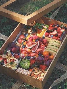 a wooden box filled with lots of different types of fruit