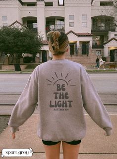 ✨Be the light Christian bible verse sweatshirt Jesus Hoodie Aesthetic Christian Sweatshirt Women's Religious Shirt Bible Verse Shirt Christian Gifts For Her Catholic Gifts  ✨ Hey everyone! Welcome to her+em storefront. Here you'll find affordable, long-lasting shirts and sweatshirts all designed by me! These unique designs are the perfect gift for loved ones, friends, family, coworkers, and even yourself. Each order we get is made specifically for you with utmost love and care.  ✨ TO ORDER:  * read the product photos and description to review the product * select the correct size and color from the two drop down menus * click add to cart * if you are done shopping, proceed to checkout accordingly with the correct address. ✨ WASHING: * It's recommended to wash inside out, on cold, with like Inspirational Slogan Sweatshirt In Relaxed Fit, Pre-shrunk Long Sleeve Sweatshirt, Pre-shrunk Long Sleeve Sweatshirt For Everyday, Everyday Long Sleeve Sweatshirt, Inspirational Winter Sweatshirt With Relaxed Fit, Inspirational Text Print Sweatshirt With Relaxed Fit, Inspirational Crew Neck Sweatshirt In Relaxed Fit, Inspirational Relaxed Fit Sweatshirt For Winter, Jesus Sweatshirts