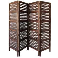 a wooden room divider with holes in it