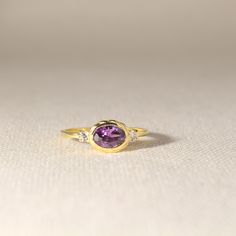 14k Solid Gold Amethyst Ring Gold Purple Natural Gemstone Ring Design Statement & Anniversary Rings for Women with Yellow Rose White Gold Options ➤ Ring Details * 14K / 18K Yellow Gold or Yellow Sterling Silver * Gold Color Options; 14K / 18K White, Yellow, Rose Gold * Sterling Silver Color Options; Yellow, Rose, White * Band Width: 1.51 mm * Top Width: 9x6.85 mm * Thickness: 1.70 mm ➤ Gem Details * Gemstone 1: Amethyst * Gem Color: Purple * Gem width: 4 millimeter * Gem length: 6 millimeter * Cut Type: Oval * Gemstone 2 : Moissanite * Gem width: 1.7*1.7 millimeter * Cut Type: Round * Ready to Ship 3-5 Business Days 💍 ISEA Jewels' pieces are handcrafted by 10-15 years of experienced craftsmen and made to order in a very short time. 🎁 All pieces come in a quality and hygienic suede gift b Fine Jewelry 14k Gold Amethyst Ring With Round Cut, Purple Gemstone Diamond Ring In 14k Gold, Lavender Amethyst Ring In 14k Gold For Anniversary, Purple Diamond Ring In 14k Gold, Heirloom Purple Sapphire Ring For Anniversary, Lavender Oval Amethyst Ring With Gemstone Accents, Purple Diamond Ring With Gemstone Accents For Anniversary, Fine Jewelry Purple Diamond Ring With Gemstone Accents, Purple Diamond Ring With Gemstone Accents