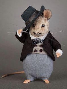 a mouse dressed in a suit and top hat