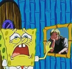 the spongebob is looking at his reflection in the mirror while he's holding his hand up to his face