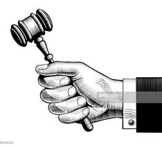 a hand holding a judge's hammer