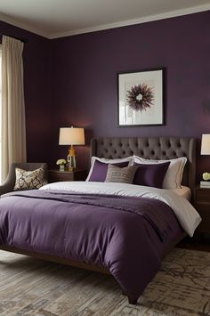 a bedroom with purple walls and white bedding, two lamps on either side of the bed