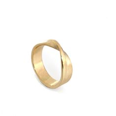 Who doesn't love a simple mobius strip, its a great simple change from a streamline band. The one pictured here is made of solid 14k yellow gold but can be made in other karats, colors and nickle free options, feel free to convo me for a quote. This ring measures 6mm wide by 1.5mm thick. It is pictured with a brushed finish with a polished edge but is also available in an all polished or all brushed. This ring will be hallmarked. I can make this ring in full, half and quarter sizes as, just let