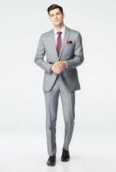 Make every occasion a special occasion with our luxury Super 150s wool fabrics. The best suit in your closet offers warmth, softness and that 'je ne sais quoi' quality that turns heads and gives you that special edge. Gray Suit Shirt Color Combos, Men Gray Suit Outfit, Men’s Grey Suit, Custom Fit Suit In Suiting Fabric, Classic Slim Fit Winter Sets, Classic Slim Fit Sets For Winter, Fitted Winter Suits For Tailoring, Timeless Fitted Winter Suit, Tailored Wedding Suits For Winter