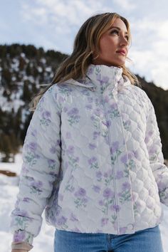 Upgrade your outerwear game with our first ever Quilted Jackets! The white base is adorned with a delicate lavender floral print and quilt embroidery, making it a stylish choice for any occasion. The detachable hood and functional closures provide versatility, while the elastic ruched cuffs and soft elastic hem ensure a comfortable fit. Stay warm and cozy with this lined Ivy puffer coat. Bakery Uniform, Mt Joy, Iceland Honeymoon, Outfit Bar, Quilt Embroidery, Ivy City Co, Womens Quilted Jacket, Warm Winter Jackets, City Woman