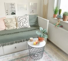 a living room filled with lots of furniture and decor on top of a white table