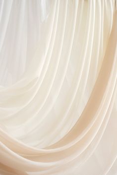 an abstract photo of white pleated fabric