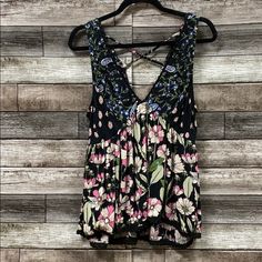 Floral Boho Tank With Crisscrossed Spaghetti Strap Back. Embroidered Trim On Neck Line And Bottom Of Tank. 100% Rayon Nwt From Our Nj Boutique Summer Beach Tank Top With Cross Back, Casual Black Cross Back Top, Beach Cami Top With Crisscross Straps, Black Summer Top With Cross Back, Black Summer Tops With Cross Back, Black Cross Back Top For Summer, Black Tops With Crisscross Straps For Spring, Cross Back Top For Day Out In Spring, Spring Cross Back Top For Day Out