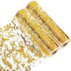 yellow and white glittered paper rolls on top of each other