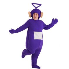 a man in a purple monkey costume is smiling and dancing with his hands out to the side