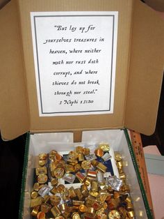 a box filled with lots of gold coins and some writing on the inside of it