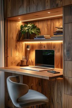 a wooden desk with a computer on it and a chair in front of the desk