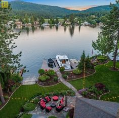 an aerial view of a boat dock in the middle of a lake