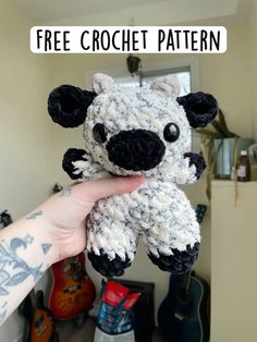 a hand holding a crocheted stuffed animal with the words free crochet pattern above it