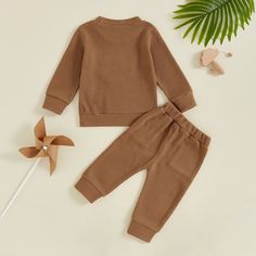 Get your little cow lover ready for autumn in our MOOODY Waffle Knit Outfit. This baby boy outfit features adorable cow embroidery, perfect for your little one's daily adventures. Made with a cozy waffle knit material, your little one will look cute and stay comfortable all day long. Solid Color Playtime Sets For Fall, Fall Playtime Solid Color Sets, Cozy Playtime Sets For Fall, Brown Long Sleeve Winter Sets, Cow Embroidery, Summer Outfit Accessories, Ready For Autumn, Pants Outfit Fall, Boy Onesie