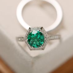 This ring features a 7mm round lab emerald and sterling silver finished with rhodium. Customization is available. It is made by hand, and it will take about 7 days to finish the ring after your payment is completed. Main stone: lab emerald Main stone weight: Approx 1.10 ct Metal type: sterling silver finished with rhodium Accent stone: cz Customization is available, I also can make it with 14k solid gold (white or yellow or rose) and diamond accent stone, just feel free to contact me. Any questi Cathedral Wedding Ring, Wedding Ring Sets For Women, Emerald Ring Engagement, Cushion Cut Halo Ring, Ring Sets For Women, Black Spinel Ring, May Birthstone Rings, Pear Cut Ring, Green Gemstone Ring